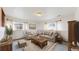 Cozy living room with neutral tones, large area rug, and comfortable seating arrangements at 412 N 10Th Ave, Brighton, CO 80601
