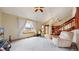 Bright living room with vaulted ceilings, large window with a window box, and staircase leading to the second floor at 412 N 10Th Ave, Brighton, CO 80601
