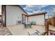 Spacious outdoor patio featuring a table and chairs with cozy sitting area and backyard shed at 412 N 10Th Ave, Brighton, CO 80601