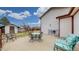 Spacious outdoor patio featuring a table and chairs, with a cozy sitting area at 412 N 10Th Ave, Brighton, CO 80601
