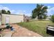 Expansive backyard offering a large grassy area, a patio with stone pavers, and a detached garage at 150 N 7Th Ave, Brighton, CO 80601