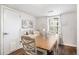 Inviting dining area features a wood table with seating for six and decoratively adorned white walls at 150 N 7Th Ave, Brighton, CO 80601