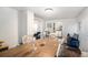 Spacious dining room with hardwood floors, white walls, and archway views at 150 N 7Th Ave, Brighton, CO 80601