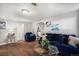 Comfortable living room featuring a plush blue sofa and stylish glass table at 150 N 7Th Ave, Brighton, CO 80601