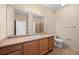 Bathroom featuring a white sink vanity and a full shower with white tiling at 2662 S Cathay Way # 110, Aurora, CO 80013