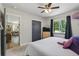 Bright bedroom with large window, hardwood floors, closet, and cozy decor at 2050 S Wolff St, Denver, CO 80219