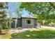 Charming single-story home with gray brick and manicured front yard, offering lovely curb appeal at 2050 S Wolff St, Denver, CO 80219