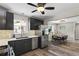 Updated kitchen showcasing sleek countertops, modern cabinetry, stainless steel appliances, and an open layout at 2050 S Wolff St, Denver, CO 80219