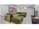 Spacious living area with plush seating, modern decor, and recessed lighting at 2050 S Wolff St, Denver, CO 80219