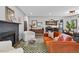 Cozy living room open to dining area with modern decor, stylish furniture, and hardwood floors at 2050 S Wolff St, Denver, CO 80219