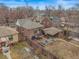 Cozy brick home featuring a fenced backyard with a covered carport and a well-maintained lawn with garden beds at 1683 S Lafayette St, Denver, CO 80210