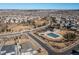 Aerial view showcasing community amenities, including a pool and playground at 17901 E Emilia Dr, Parker, CO 80134