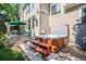 Exterior view of a home's backyard showcasing a hot tub and an outdoor entertainment area at 7120 Forest Ridge Cir, Castle Pines, CO 80108
