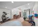 Bright basement featuring an exercise area and dining space with natural light from outside entrance at 7120 Forest Ridge Cir, Castle Pines, CO 80108
