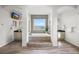 Bright bathroom featuring a luxurious soaking tub, stone accents, dual vanities and elegant wood tile flooring at 7120 Forest Ridge Cir, Castle Pines, CO 80108