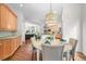 Bright breakfast nook featuring a stylish chandelier and an adjacent kitchen at 7120 Forest Ridge Cir, Castle Pines, CO 80108