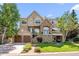 Stunning two-story home with a stone facade, two-car garage, manicured lawn and inviting curb appeal at 7120 Forest Ridge Cir, Castle Pines, CO 80108