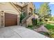 Garage and walkway to front entrance with beautiful stone exterior and landscaping at 7120 Forest Ridge Cir, Castle Pines, CO 80108