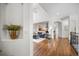 Hallway displaying hardwood floors, archways, high ceilings, and a view of the living room at 7120 Forest Ridge Cir, Castle Pines, CO 80108