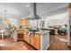 Open kitchen with a large island, modern appliances, and an adjacent dining area at 7120 Forest Ridge Cir, Castle Pines, CO 80108