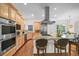 Spacious kitchen with stainless steel appliances, a granite island, and ample cabinet space at 7120 Forest Ridge Cir, Castle Pines, CO 80108