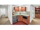 Basement kitchenette with granite counters, stainless steel appliances, and wood cabinets at 7120 Forest Ridge Cir, Castle Pines, CO 80108