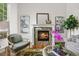 Cozy living room with a stone fireplace, plush seating, and natural light at 7120 Forest Ridge Cir, Castle Pines, CO 80108