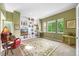 Well-lit living room with custom built-in shelving and a large decorative area rug at 7120 Forest Ridge Cir, Castle Pines, CO 80108