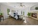 Cozy main bedroom with tray ceilings, fireplace, and access to balcony at 7120 Forest Ridge Cir, Castle Pines, CO 80108