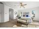 Bright main bedroom showcases a tray ceiling, windows, and ample space at 7120 Forest Ridge Cir, Castle Pines, CO 80108