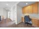 Office space featuring built-in shelves, desk and ample natural light at 7120 Forest Ridge Cir, Castle Pines, CO 80108