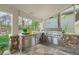 Outdoor kitchen featuring stone surround, stainless steel appliances, and a built in grill at 7120 Forest Ridge Cir, Castle Pines, CO 80108