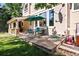 Patio with flagstone and green umbrella and seating, perfect for outdoor entertaining at 7120 Forest Ridge Cir, Castle Pines, CO 80108