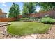Expansive backyard featuring lush green lawn, well-maintained landscaping, and beautiful wooden fence at 11645 Colony Loop, Parker, CO 80138