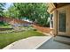 Backyard featuring synthetic lawn and tiered flowerbeds at 11645 Colony Loop, Parker, CO 80138