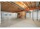 Unfinished basement featuring concrete floor, exposed ceiling, and framing at 11645 Colony Loop, Parker, CO 80138