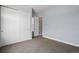 Simple bedroom with white closet doors and neutral colors, offering a calming and inviting atmosphere at 11645 Colony Loop, Parker, CO 80138