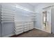 Organized walk-in closet with ample shelving and drawers for efficient storage solutions at 11645 Colony Loop, Parker, CO 80138
