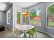 Sunny dining area with backyard garden view from many windows at 11645 Colony Loop, Parker, CO 80138
