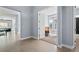 Inviting foyer showcasing tiled floors, an open study, and a hallway at 11645 Colony Loop, Parker, CO 80138