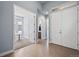 Bright foyer with tiled floors, a double-door entrance, and an open view to the study at 11645 Colony Loop, Parker, CO 80138
