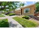 Beautiful single-story house featuring a well maintained lawn and an arched window at 11645 Colony Loop, Parker, CO 80138