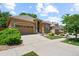 Charming single-story home with a two-car garage, landscaped yard and sidewalk at 11645 Colony Loop, Parker, CO 80138