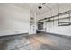 Spacious garage with concrete floor and metal shelving at 11645 Colony Loop, Parker, CO 80138