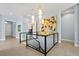 Bright hallway with modern lighting and a glass-paneled staircase leading to the lower level at 11645 Colony Loop, Parker, CO 80138