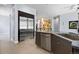 Spacious open kitchen features stainless steel appliances and a large island with bar seating at 11645 Colony Loop, Parker, CO 80138