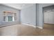 Bright living room with tile flooring, large window, and neutral paint at 11645 Colony Loop, Parker, CO 80138
