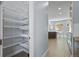 Large pantry with ample shelving provides plenty of storage space at 11645 Colony Loop, Parker, CO 80138
