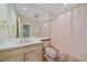 Bathroom with a large mirror, a single sink, and a shower with pink curtain at 787 W Meadow Rd, Evergreen, CO 80439