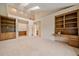 Carpeted bedroom featuring built-in shelving, a skylight, and doorways leading to other rooms at 787 W Meadow Rd, Evergreen, CO 80439